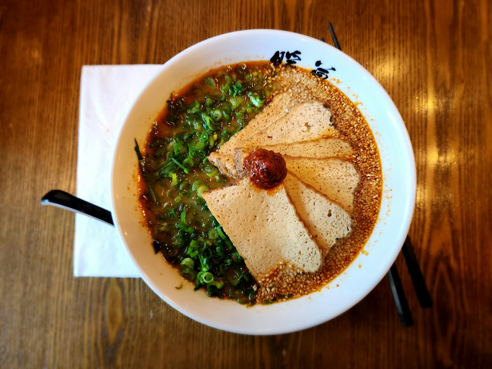 a bowl of soup on a wooden table